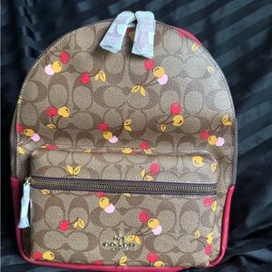 Coach Med Charlie Backpack, brown logo background, cherries pattern Retail $375